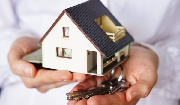 closeup-shot-person-thinking-buying-selling-house