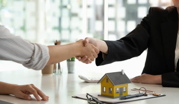 real-estate-broker-customer-shaking-hands-after-signing-contract-real-estate-home-loan-insurance-concept